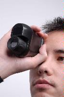 A set of photographs of models posing with MicroEmissive Displays optical hardware including goggles and a range finder.  7 images.  For use in the MED 2008 Annual Report.