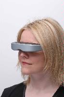 A set of photographs of models posing with MicroEmissive Displays optical hardware including goggles and a range finder.  7 images.  For use in the MED 2008 Annual Report.