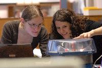 Photographs of Jennifer Owen and Christine Straight performing an unknown experiment during their 3rd Year Physics Laboratories.