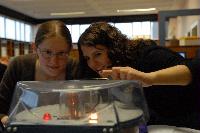 Photographs of Jennifer Owen and Christine Straight performing an unknown experiment during their 3rd Year Physics Laboratories.