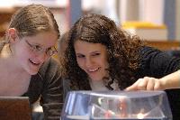 Photographs of Jennifer Owen and Christine Straight performing an unknown experiment during their 3rd Year Physics Laboratories.