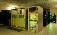 Photographs of the QCDOC supercomputer.