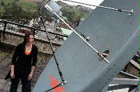 A set of photographs of Keri Niccoll, likely a student of the University of Edinburgh Meteorology department.  Pictures are included on top of the JCMB roof and with a projection of a weather map on her face.  Likely taken for the Science and Engineering magazine.