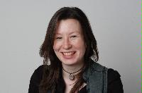 A set of photographs of Keri Niccoll, likely a student of the University of Edinburgh Meteorology department.  Pictures are included on top of the JCMB roof and with a projection of a weather map on her face.  Likely taken for the Science and Engineering magazine.