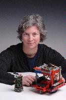 A set of photographs of Professor Barbara Webb of the University of Edinburgh School of Informatics.  Pictured with electronic circuitry and components.