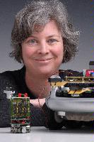 A set of photographs of Professor Barbara Webb of the University of Edinburgh School of Informatics.  Pictured with electronic circuitry and components.