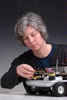 A set of photographs of Professor Barbara Webb of the University of Edinburgh School of Informatics.  Pictured with electronic circuitry and components.