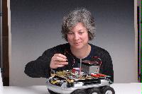 A set of photographs of Professor Barbara Webb of the University of Edinburgh School of Informatics.  Pictured with electronic circuitry and components.