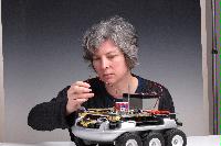 A set of photographs of Professor Barbara Webb of the University of Edinburgh School of Informatics.  Pictured with electronic circuitry and components.