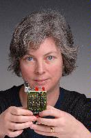 A set of photographs of Professor Barbara Webb of the University of Edinburgh School of Informatics.  Pictured with electronic circuitry and components.