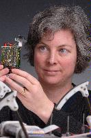 A set of photographs of Professor Barbara Webb of the University of Edinburgh School of Informatics.  Pictured with electronic circuitry and components.