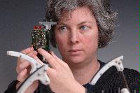 A set of photographs of Professor Barbara Webb of the University of Edinburgh School of Informatics.  Pictured with electronic circuitry and components.