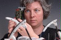 A set of photographs of Professor Barbara Webb of the University of Edinburgh School of Informatics.  Pictured with electronic circuitry and components.