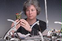 A set of photographs of Professor Barbara Webb of the University of Edinburgh School of Informatics.  Pictured with electronic circuitry and components.