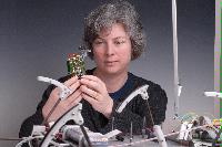 A set of photographs of Professor Barbara Webb of the University of Edinburgh School of Informatics.  Pictured with electronic circuitry and components.