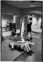 A set of images of people working out at a gym.  Taken February 2003.