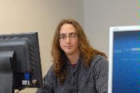 A set of photographs of a man named James Addison, pictured with computers.  Images taken for the Science and Engineering publication in March 2007.