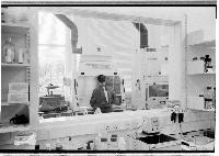 A set of images of a scientist working in a chemistry lab.  Taken February 2003.