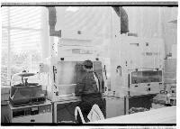 A set of images of a scientist working in a chemistry lab.  Taken February 2003.