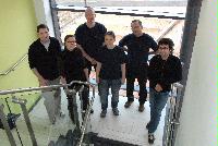 An image of EPCC staff wearing t-shirts in order to promote the OGSA DAI computing system.