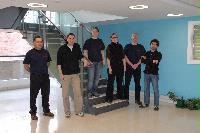 An image of EPCC staff wearing t-shirts in order to promote the OGSA DAI computing system.