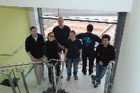 An image of EPCC staff wearing t-shirts in order to promote the OGSA DAI computing system.