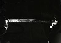 A series of photographs of glass flutes for an acoustics experiment to show the response of the air in the flute to incoming air when it is played, as well as the extablishment of a standing wave. It is shown by using pollen and photographing the pattern of the pollen. Photographed by Peter Tuffy.