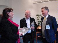Photographs of Professor Peter Higgs and Professor Richard Kenway visiting St Andrews House, on Regent Road, Calton Hill, Edinburgh. In one of the photographs Professor Higgs can be seen signing a copy of "Exploring the Mystery of Matter", a hardcover book about the ATLAS Experiment. Photographs taken on the 10th of September, 2008.