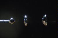 Photographs of a physics experiment entitled "The Singing Bubbles". The experiment was part of a 4th Year project by Mr Diarmuid Lloyd and mostly consisted in an attempt to capture images of a bubble at different stages of formation as it left a very thin glass nozzle.