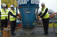 Photographs of Professor Timothy O'Shea and Mr Nichol Stephen MSP visiting the construction site for the Dugald Stewart Building and pouring some cement into the foundations.