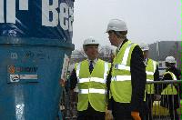 Photographs of Professor Timothy O'Shea and Mr Nichol Stephen MSP visiting the construction site for the Dugald Stewart Building and pouring some cement into the foundations.