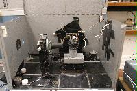 Photographs of a Raman Spectroscope, including the sample area, the lead screw area and a Rapidsyn stepper motor.