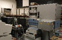Photographs of a Raman Spectroscope, including the sample area, the lead screw area and a Rapidsyn stepper motor.