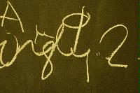 Photographs of a vandalised Peter Higgs mechanism board.
