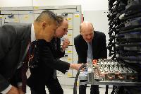 Joint HECToR Phase 3 (Cray) and Blue Gene/Q (IBM) launch, Feb 2012: George Chiu IBM; Dr Peter Boyle; David Willetts, Minister for Universities and Science; Lily Johnson (won comp to design HECToR doors graphic); Prof Arthur Trew, Prof Nigel Brown (Vice-Principal Planning, Resources and Research Policy), Prof Richard Kenway; Professor Sir Timothy O'Shea (Principal); Fiona Burgess (Cray); Ulla Thiel (Cray Vice President for Europe, the Middle East and Africa); Dr Mark Parsons (EPCC Joint Director); David Delpy (EPSRC Chief Executive);