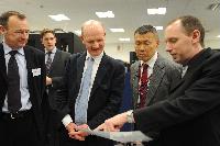 Joint HECToR Phase 3 (Cray) and Blue Gene/Q (IBM) launch, Feb 2012: George Chiu IBM; Dr Peter Boyle; David Willetts, Minister for Universities and Science; Lily Johnson (won comp to design HECToR doors graphic); Prof Arthur Trew, Prof Nigel Brown (Vice-Principal Planning, Resources and Research Policy), Prof Richard Kenway; Professor Sir Timothy O'Shea (Principal); Fiona Burgess (Cray); Ulla Thiel (Cray Vice President for Europe, the Middle East and Africa); Dr Mark Parsons (EPCC Joint Director); David Delpy (EPSRC Chief Executive);