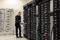 Joint HECToR Phase 3 (Cray) and Blue Gene/Q (IBM) launch, Feb 2012: George Chiu IBM; Dr Peter Boyle; David Willetts, Minister for Universities and Science; Lily Johnson (won comp to design HECToR doors graphic); Prof Arthur Trew, Prof Nigel Brown (Vice-Principal Planning, Resources and Research Policy), Prof Richard Kenway; Professor Sir Timothy O'Shea (Principal); Fiona Burgess (Cray); Ulla Thiel (Cray Vice President for Europe, the Middle East and Africa); Dr Mark Parsons (EPCC Joint Director); David Delpy (EPSRC Chief Executive);