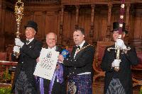 Professor Peter Higgs and the Lord Provost of the City of Edinburgh, the Rt Hon Donald Wilson accompanied by the Cermonial Mace and Sword of trhe University; Edinburgh Graduation 2014