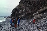 Photographs of geoscience students on an expedition, or field trip, to a rocky beach.  10 images.