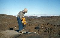 Photographs of geoscience students on an expedition, or field trip, to a rocky beach.  10 images.