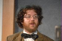 Photographs of an unknown man talking at the UK e-Science All Hands Meeting, September 2008.