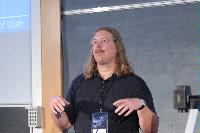 Photographs of Professor Christopher R. Johnson talking during the UK e-Science All Hands Meeting, September 2008, in a lecture theatre in Appleton Tower, George Square.
