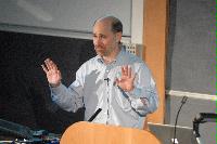 Photographs of Robert Grossman, the Managing Partner of Open Data Group, talking at the UK e-Science All Hands Meeting, September 2008, in a lecture theatre in Appleton Tower.