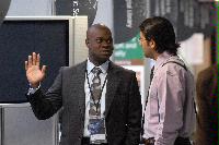 Photographs of Mr Gilbert Mensah, account Manager at The MathWorks, at the UK e-Science All Hands Meeting, September 2008.