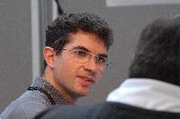 Photographs of unknown people at the UK e-Science All Hands Meeting, September 2008. Locations include the Appleton Tower foyer and lecture theatres as well a several locations within the Dugald Stewart Building at the University of Edinburgh.