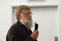 Photographs of unknown men talking at the UK e-Science All Hands Meeting, September 2008, in one of the Appleton Tower lecture theatres.