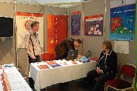 Photographs of stands at the UK e-Science All Hands Meeting, September 2008, in Appleton Tower, George Square. In the photographs four known people are present: Mr Gilbert Mensah, Dr Phil Trinder, Dr Mario Antonioletti and Dr Tim Parkinson. The rest are unknown.