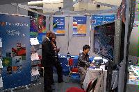 Photographs of stands at the UK e-Science All Hands Meeting, September 2008, in Appleton Tower, George Square. In the photographs four known people are present: Mr Gilbert Mensah, Dr Phil Trinder, Dr Mario Antonioletti and Dr Tim Parkinson. The rest are unknown.