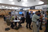 Photographs of stands at the UK e-Science All Hands Meeting, September 2008, in Appleton Tower, George Square. In the photographs four known people are present: Mr Gilbert Mensah, Dr Phil Trinder, Dr Mario Antonioletti and Dr Tim Parkinson. The rest are unknown.