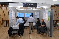 Photographs of stands at the UK e-Science All Hands Meeting, September 2008, in Appleton Tower, George Square. In the photographs four known people are present: Mr Gilbert Mensah, Dr Phil Trinder, Dr Mario Antonioletti and Dr Tim Parkinson. The rest are unknown.